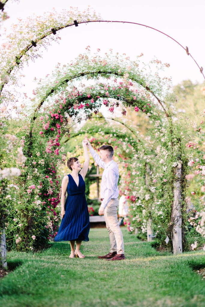 The author and her future husband in an engagement photo in a garden.